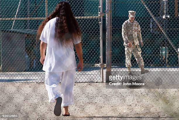 Detainee walks across a recreation ground inside the U.S. Military prison for "enemy combatants" on October 27, 2009 in Guantanamo Bay, Cuba....