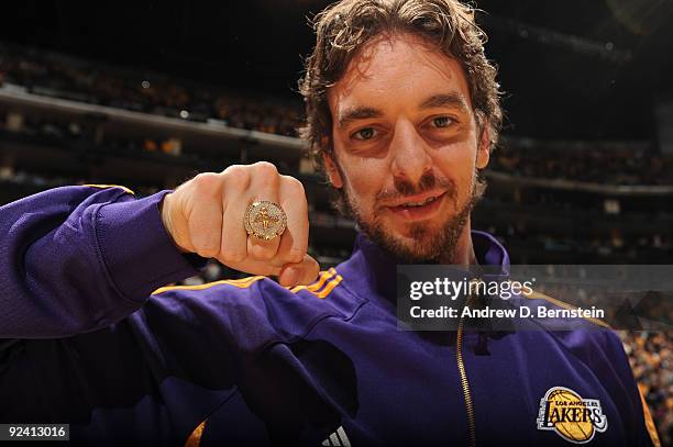 Pau Gasol of the Los Angeles Lakers shows off his 2009 NBA Championship ring before the season opener against the Los Angeles Clippers at Staples...