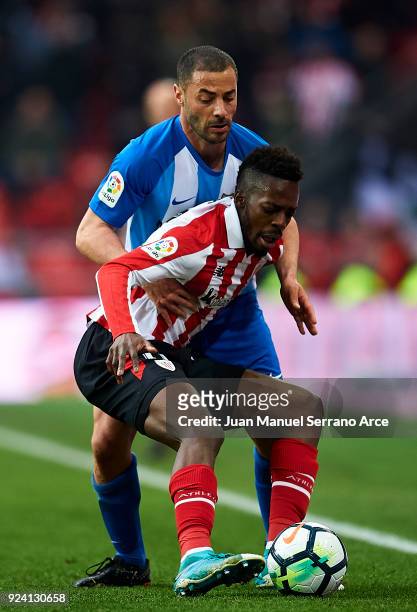 Medhi Lacen of Malaga CF competes for the ball with Inaki Williams of Athletic Club during the La Liga match between Athletic Club Bilbao and Malaga...