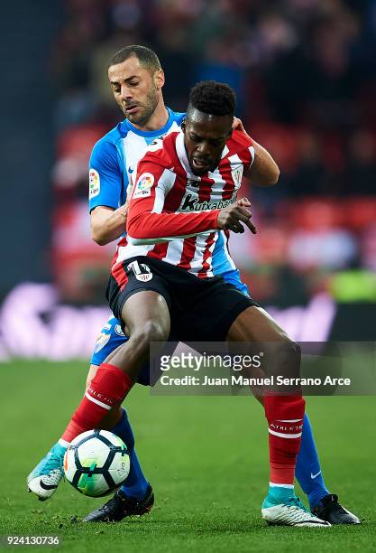 Medhi Lacen of Malaga CF competes for the ball with Inaki Williams of Athletic Club during the La Liga match between Athletic Club Bilbao and Malaga...