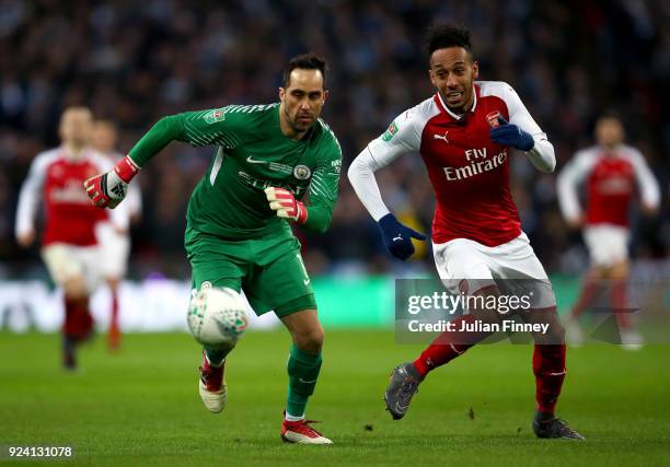 Pierre-Emerick Aubameyang of Arsenal and Claudio Bravo of Manchester City compete for the ball during the Carabao Cup Final between Arsenal and...