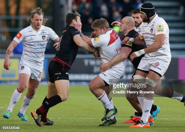 Tom Youngs of Leicester Tigers tackled by Chris Wyles and Hayden Thompson-Stringer of Saracens during the Aviva Premiership match between Saracens...