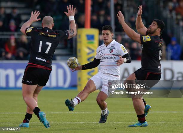 Matt Toomua of Leicester Tigers kicks past Hayden Thompson-Stringer and Titi Lamositele of Saracens during the Aviva Premiership match between...