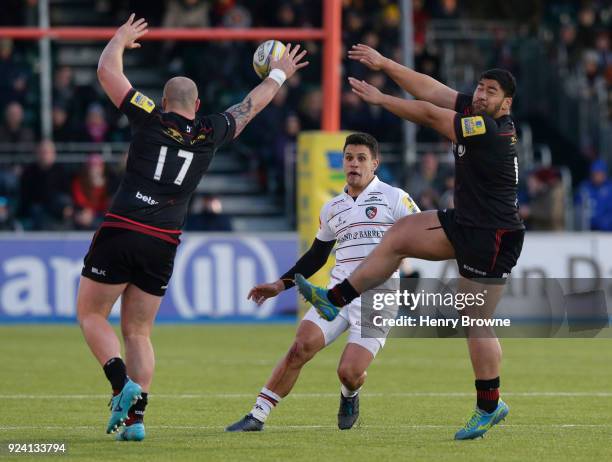 Matt Toomua of Leicester Tigers kicks past Hayden Thompson-Stringer and Titi Lamositele of Saracens during the Aviva Premiership match between...