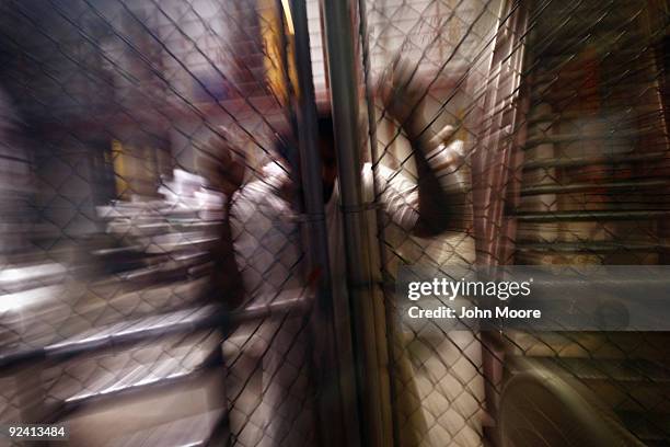 Detainee stands at an interior fence inside the U.S. Military prison for "enemy combatants" on October 27, 2009 in Guantanamo Bay, Cuba. Although...
