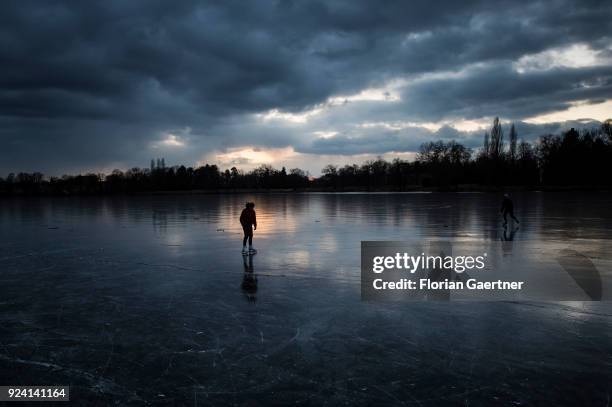 Girl skates on a frozen lake on February 25, 2018 in Potsdam, Germany.