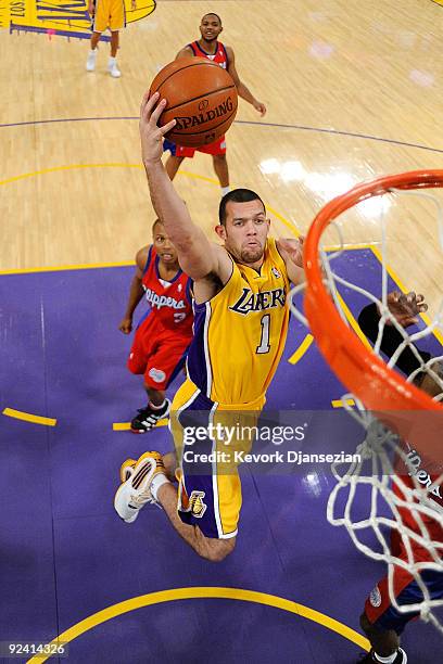 Jordan Farmar of the Los Angeles Lakers goes to the basket against the Los Angeles Clippers during the season opening game at Staples Center on...