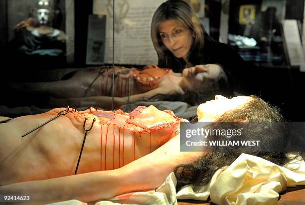 Tina Minichilli inspects a display at a Leonardo Da Vinci exhibition titled 'Anatomy to Robots', in Melbourne on October 28, 2009 a world premiere...