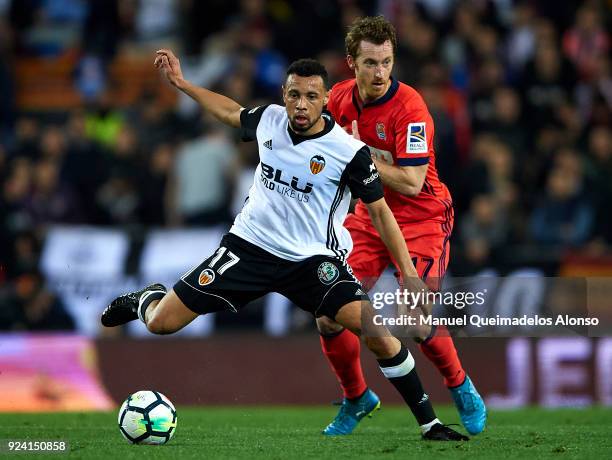 Francis Coquelin of Valencia competes for the ball with David Zurutuza of Real Sociedad during the La Liga match between Valencia CF and Real...