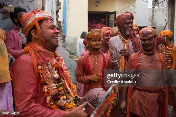 Indian women beat men with stick during celebration of Lathmar Holi in Nandgaon village of Mathura district in Uttar Pradesh, India on February 25,...