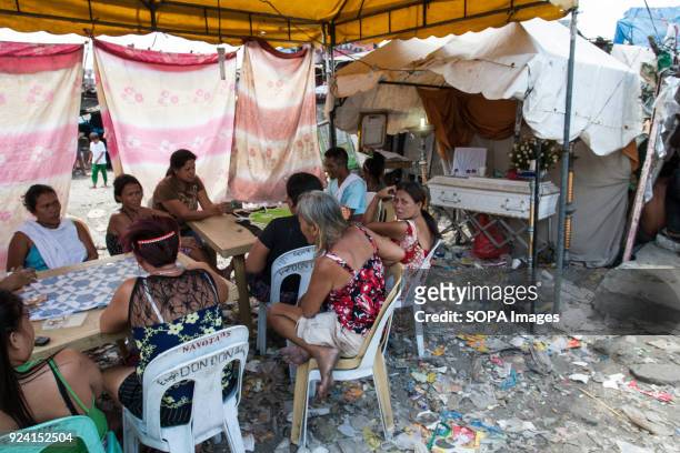 Funeral scene seen in the navotas cemetery slum. In the center of Pasay District of Metro Manila is a cemetery where over 10,000 deceased people is...