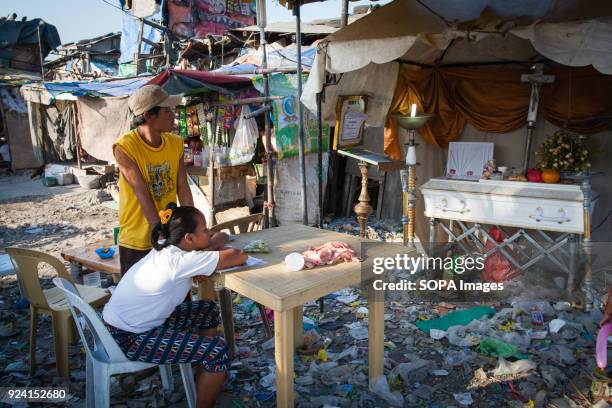 Funeral scene seen in the navotas cemetery slum. In the center of Pasay District of Metro Manila is a cemetery where over 10,000 deceased people is...