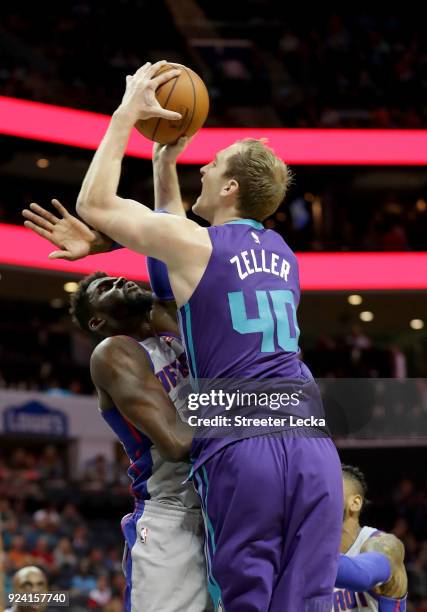 Cody Zeller of the Charlotte Hornets drives to the basket against James Ennis III of the Detroit Pistons during their game at Spectrum Center on...