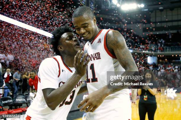 Trevon Scott of the Cincinnati Bearcats celebrates with Gary Clark after defeating the Tulsa Golden Hurricane 82-74 at BB&T Arena on February 25,...