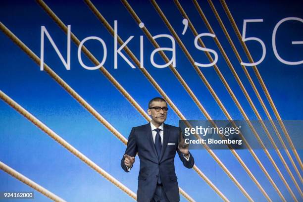 Rajeev Suri, president and chief executive officer of Nokia Oyj, gestures while speaking during a special event ahead of the Mobile World Congress in...