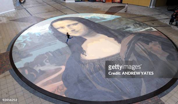 The said to be world's largest paint by numbers Mona Lisa reproduction is unveiled at the Eagles Meadow shopping centre in Wrexham, north Wales, on...