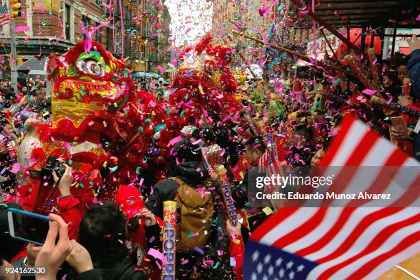 People take part in the Chinese Lunar New Year parade in Chinatown on February 25, 2018 in New York City. The Chinese New Year parade is one of the...