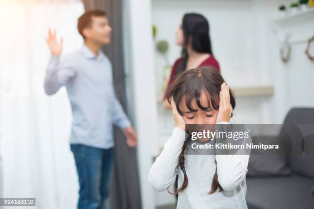 frustrated of little girl is disaster in argument of mother and father in family conflict - asian violence stock pictures, royalty-free photos & images