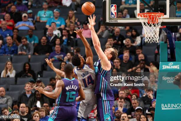 Cody Zeller of the Charlotte Hornets blocks as Ish Smith of the Detroit Pistons shoots on February 25, 2017 at Spectrum Center in Charlotte, North...