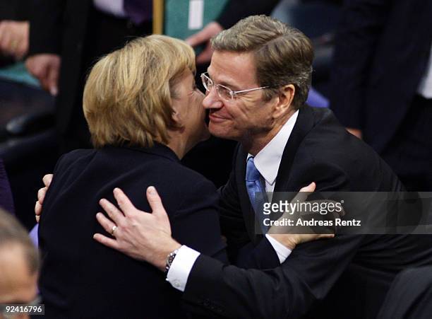 Chairman of the German Free Democrats and new German Vice Chancellor and Foreign Minister designate Guido Westerwelle congratulates German Chancellor...