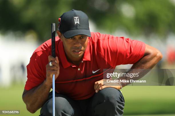 Tiger Woods lines up his putt on the fourth green during the final round of the Honda Classic at PGA National Resort and Spa on February 25, 2018 in...