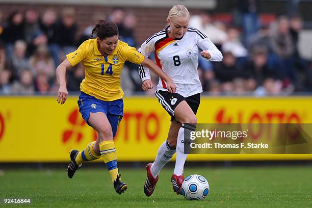 Josefin Johansson of Sweden and Kristina Gessat of Germany tackle for the ball during the women's international friendly match between Germany U20...