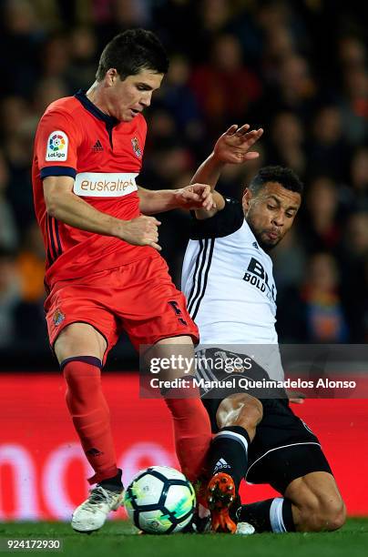 Francis Coquelin of Valencia competes for the ball with Igor Zubeldia of Real Sociedad during the La Liga match between Valencia CF and Real Sociedad...