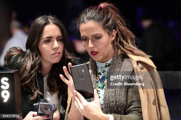 Attendees tests a Galaxy S9 smartphone during a Samsung Electronics Co. 'Unpacked' launch event ahead of the Mobile World Congress in Barcelona,...