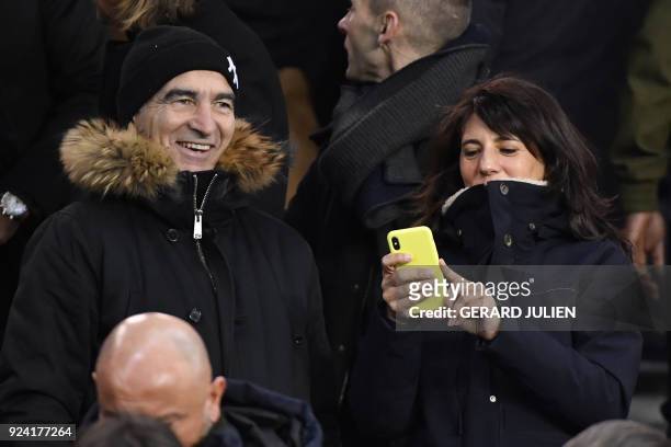 French former coach of the football national team, Raymond Domenech and his wife TV journalist Estelle Denis attend the French L1 football match...