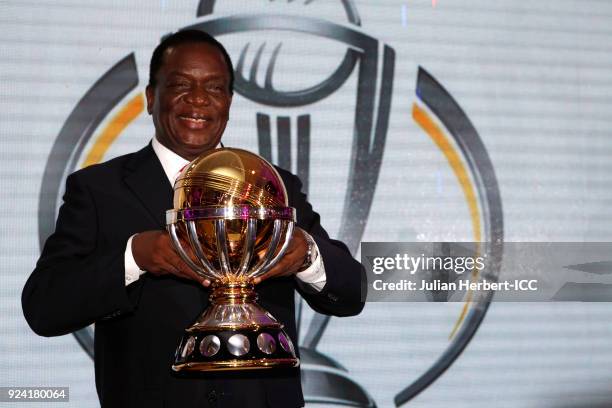 His Excellency, The President of The Republic of Zimbabwe Emmerson Mnangagwa holds the winners trophy at The Opening Ceremony Dinner for the ICC...