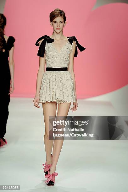 Model walks down the runway during the Moschino Cheap & Chic Fashion Show as part of the Milan Womenswear Fashion Week Spring/Summer 2010 at the...