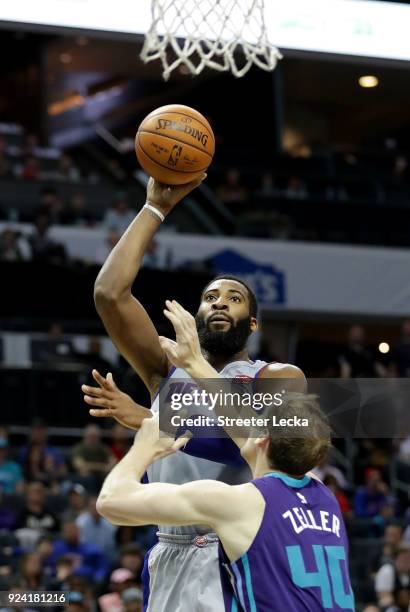 Andre Drummond of the Detroit Pistons shoots over Cody Zeller of the Charlotte Hornets during their game at Spectrum Center on February 25, 2018 in...