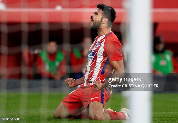 Atletico Madrid's Spanish forward Diego Costa celebrates after scoring a goal during the Spanish league football match between Sevilla FC and Club...