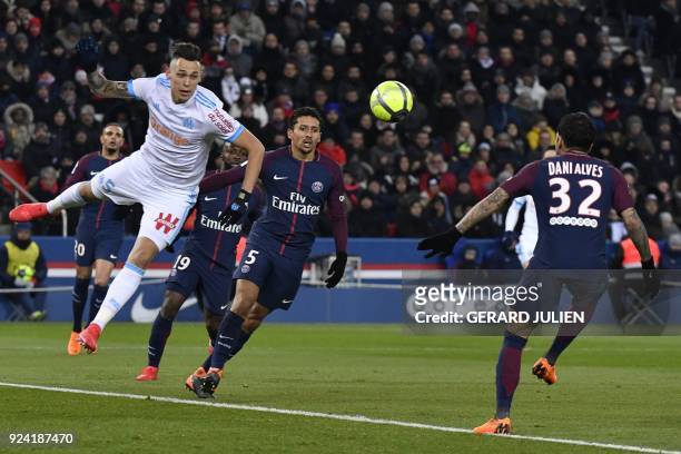 Marseille's Argentinian forward Lucas Ocampos vies with Paris Saint-Germain's Brazilian defender Marquinhos and Paris Saint-Germain's Brazilian...