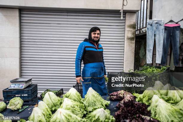 Man selling greens in Tarlabasi Sunday market in Istanbul, 25 February 2018 Every Turkish city has its own bazaar that sells local goods from the...