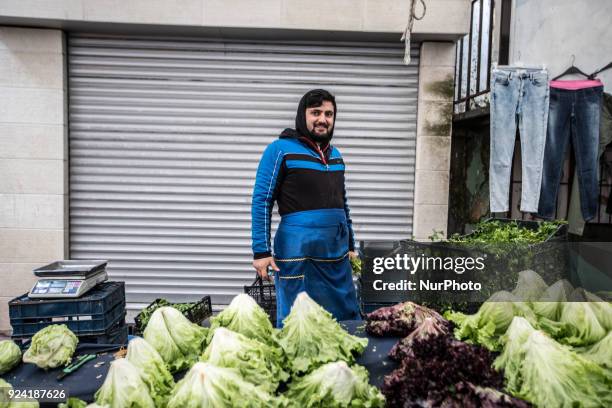 Man selling greens in Tarlabasi Sunday market in Istanbul, 25 February 2018 Every Turkish city has its own bazaar that sells local goods from the...