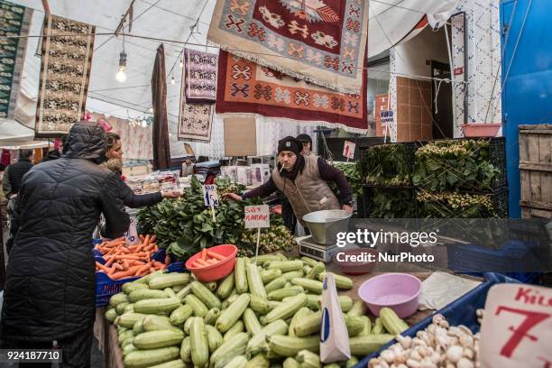 Man selling vegetables in Tarlabasi Sunday market in Istanbul, 25 February 2018 Every Turkish city has its own bazaar that sells local goods from the...