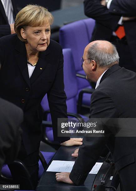 German Chancellor Angela Merkel chats with Gregor Gysi, Chairman of the German left-wing party Die Linke faction at the Bundestag on October 28, 2009...