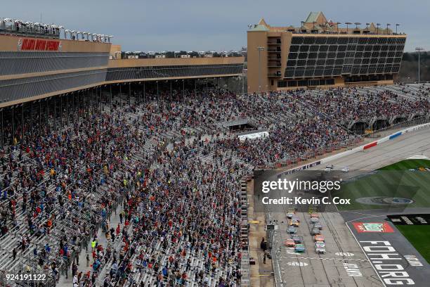 Kyle Busch, driver of the Snickers Almond Toyota, and Ryan Newman, driver of the Liberty National Chevrolet, take the green flag to start the Monster...