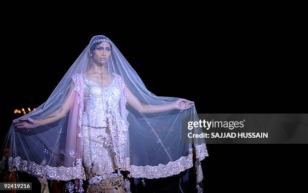 Indian Pakistani Ramp Model An Indian model walks on the ramp showcases a creation by Indian ...