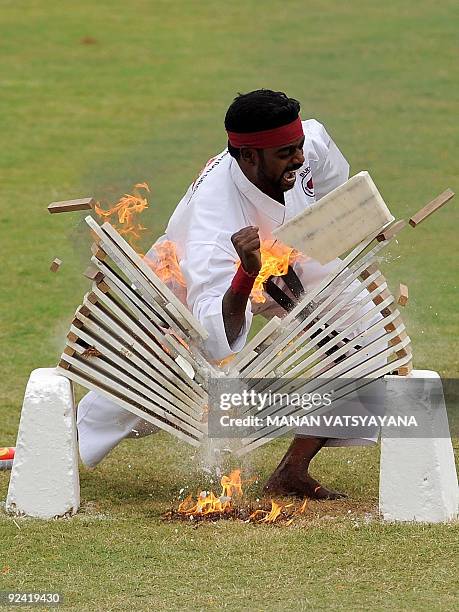 National Security Guards commonado displays his martial art skills during a function to celebrate the 25th NSG Raising day in Gurgaon, around 50 kms...