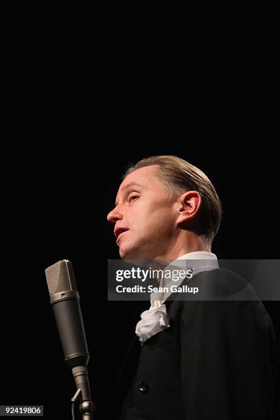 German singer Max Raabe performs with his Palast Orchester orchestra at a photocall for the release of his new DVD "Heute Nacht Oder Nie" at...