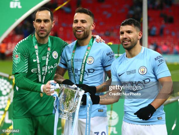 Manchester City's Claudio Bravo,Manchester City's Nicolas Otamendi and Manchester City's Sergio Aguero with Trophy during Carabao Cup Final match...