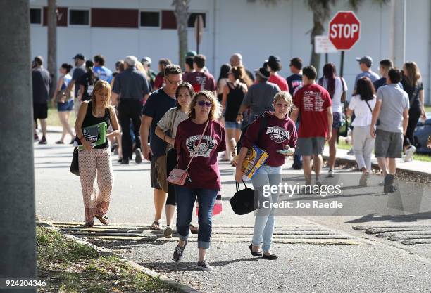 People visit Marjory Stoneman Douglas High School on February 25, 2018 in Parkland, Florida. Today, students and parents were allowed on campus for...