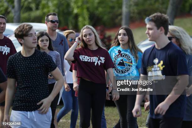 People visit Marjory Stoneman Douglas High School on February 25, 2018 in Parkland, Florida. Today, students and parents were allowed on campus for...