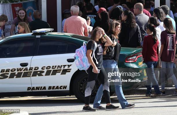 People visit Marjory Stoneman Douglas High School on February 25, 2018 in Parkland, Florida. Today, students and parents were allowed on campus for...