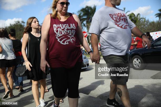 People visit Marjory Stoneman Douglas High School on February 25, 2018 in Parkland, Florida. Today, students and parents were allowed on campus for...