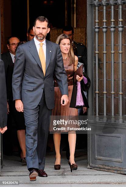 Princess Letizia of Spain and Prince Felipe of Spain leave the Red Cross Fundraising Day event , at the front door of the Foreign Affairs Ministery...