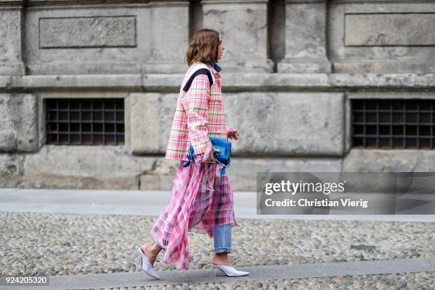 Candela Novembre wearing pink tartan jacket and skirt is seen outside MSGM during Milan Fashion Week Fall/Winter 2018/19 on February 25, 2018 in...