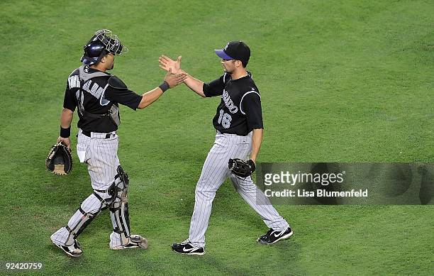 Yorvit Torrealba and Huston Street of the Colorado Rockies celebrate defeating the Los Angeles Dodgers 4-3 at Dodger Stadium on October 2, 2009 in...